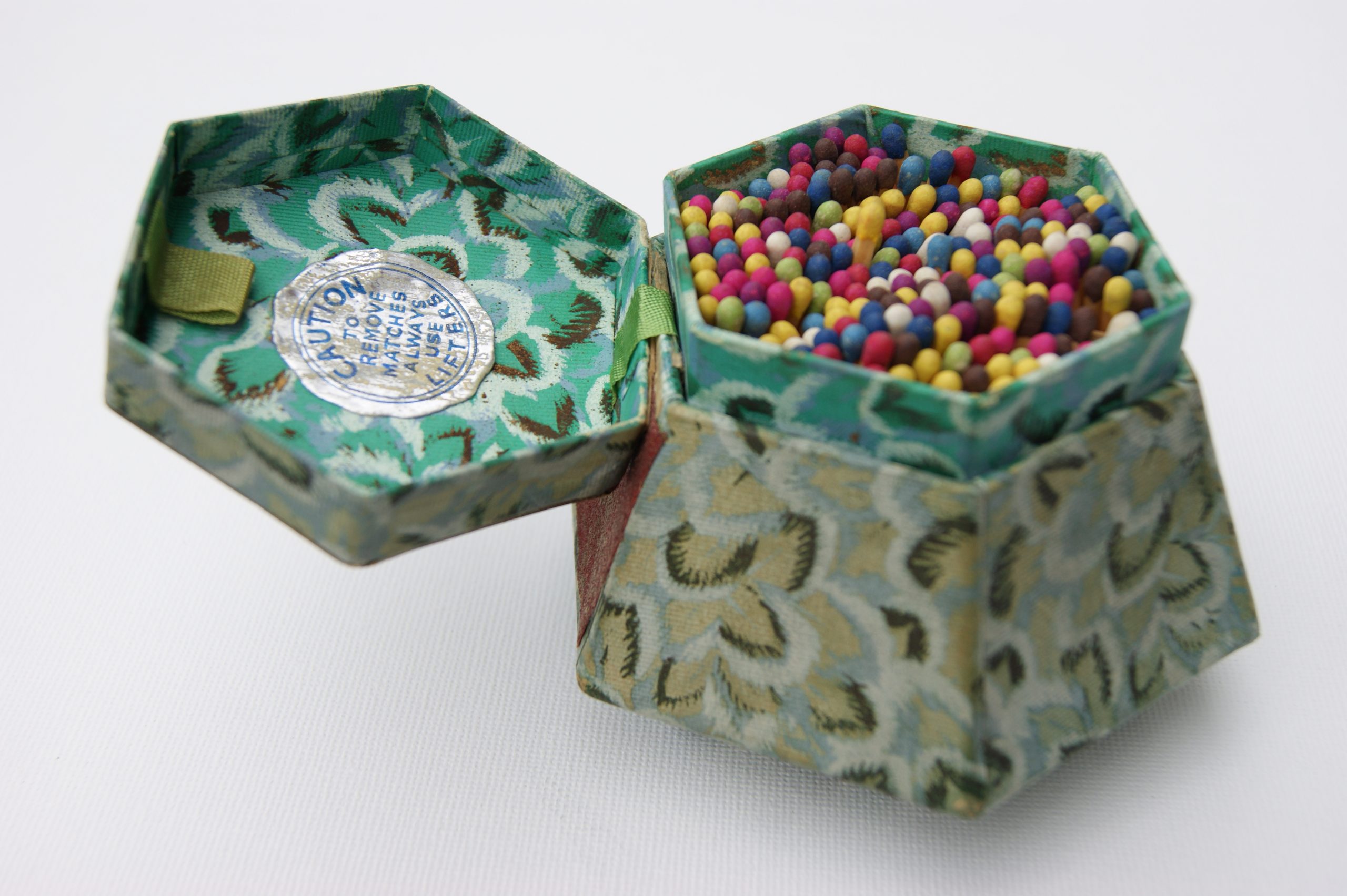 Harlequin matches in casket style card container