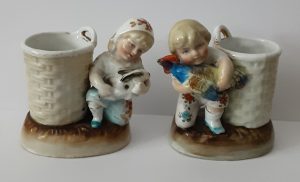 A pair of multicoloured Conta &amp; Boehme porcelain matchstrikers #4248. Glazed finish.